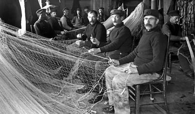 Lighthouse keeper Emmauel Luick--mending nets