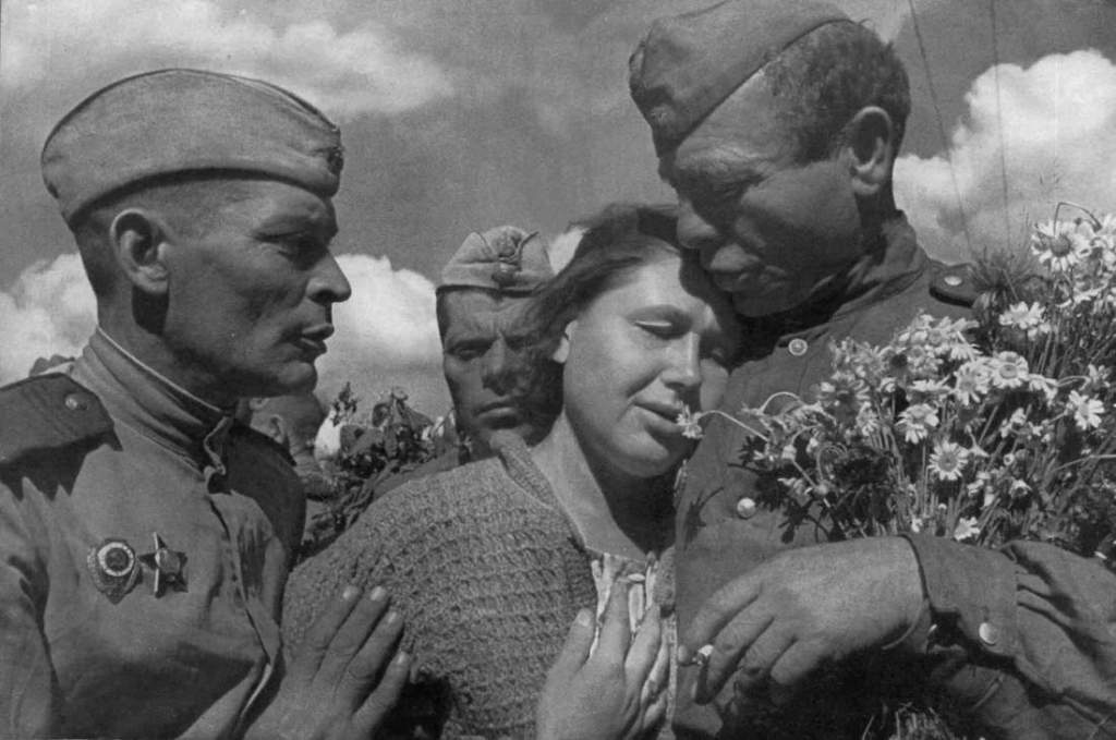 Victory day, World War II, USSR, 1945. A woman celebrating the defeat of Nazi Germany with members of the victorious Soviet Red Army. Found in the collection of the Moscow Photo Museum (House of Photography). (Photo by Fine Art Images/Heritage Images/Getty Images)