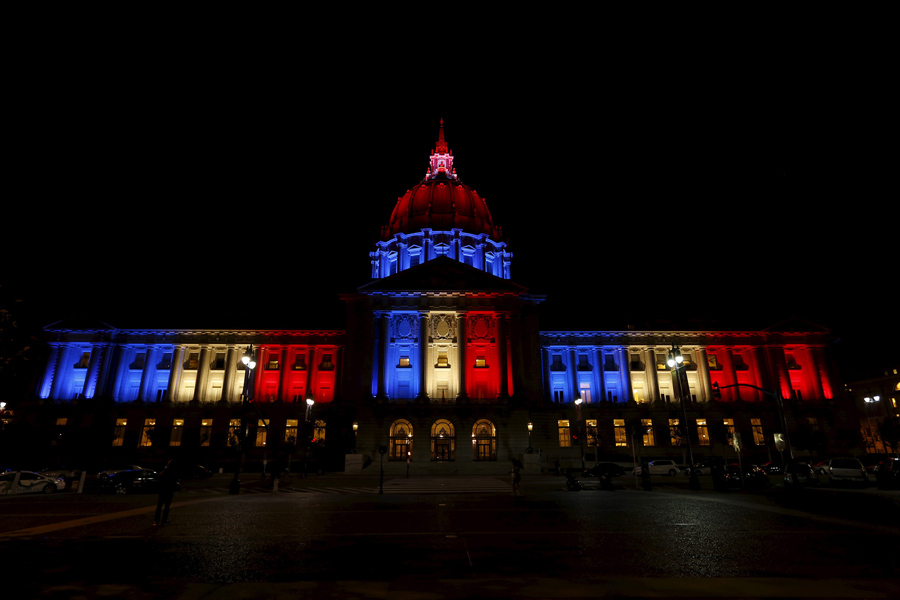 San Francisco City Hall is lit up with blue, white and red, the colors of the French flag, following the Paris terror attacks, in San Francisco, California November 13, 2015. REUTERS/Stephen Lam - RTS6XUM